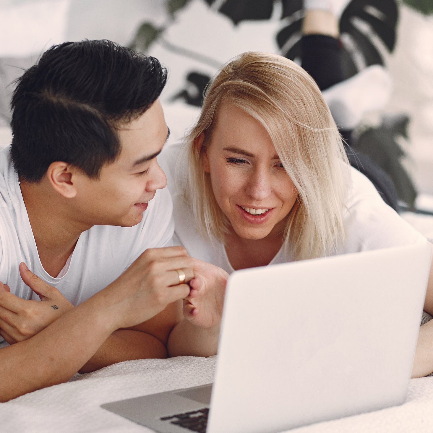 Canva - Man and Woman on Bed Using Macbook.png2500px